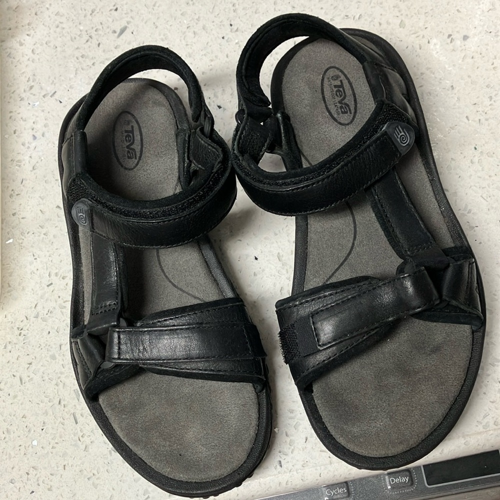 Teva waterproof black leather sandals With two size adjustments. Size 7.